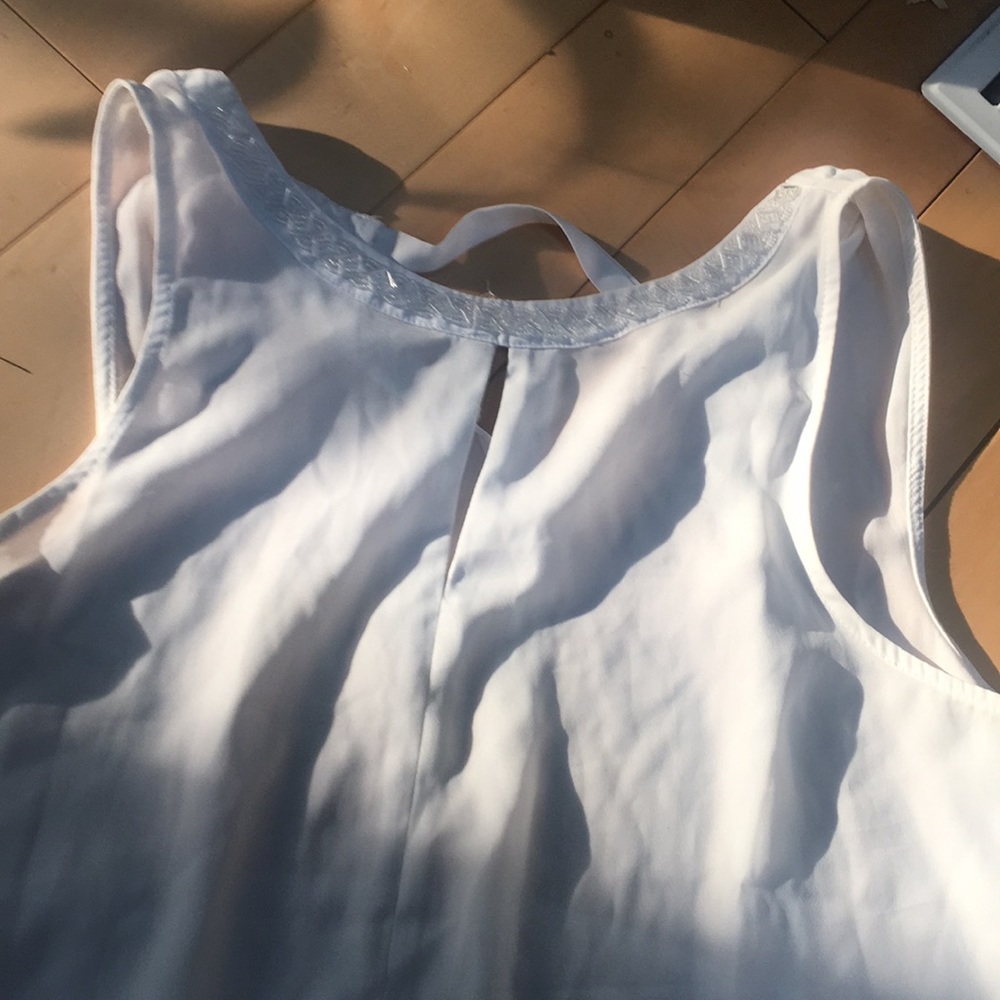 Sleeveless white embroidered top